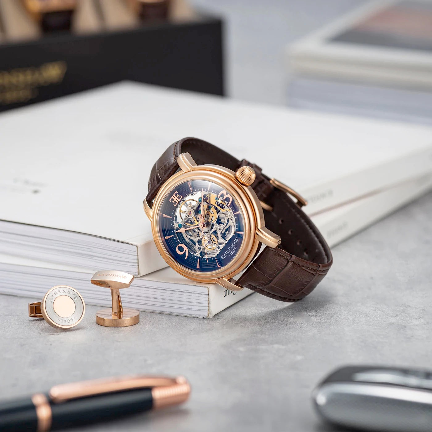 THOMAS EARNSHAW LONGCASE GRANDE SKELETON AUTOMATIC Brandy Rose Gold