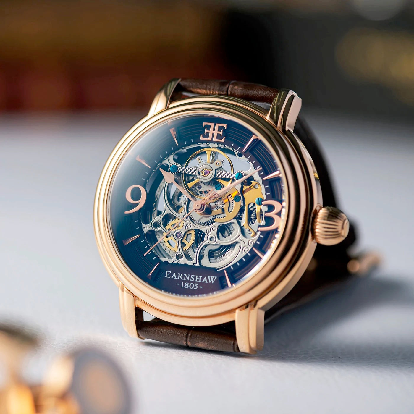 THOMAS EARNSHAW LONGCASE GRANDE SKELETON AUTOMATIC Brandy Rose Gold