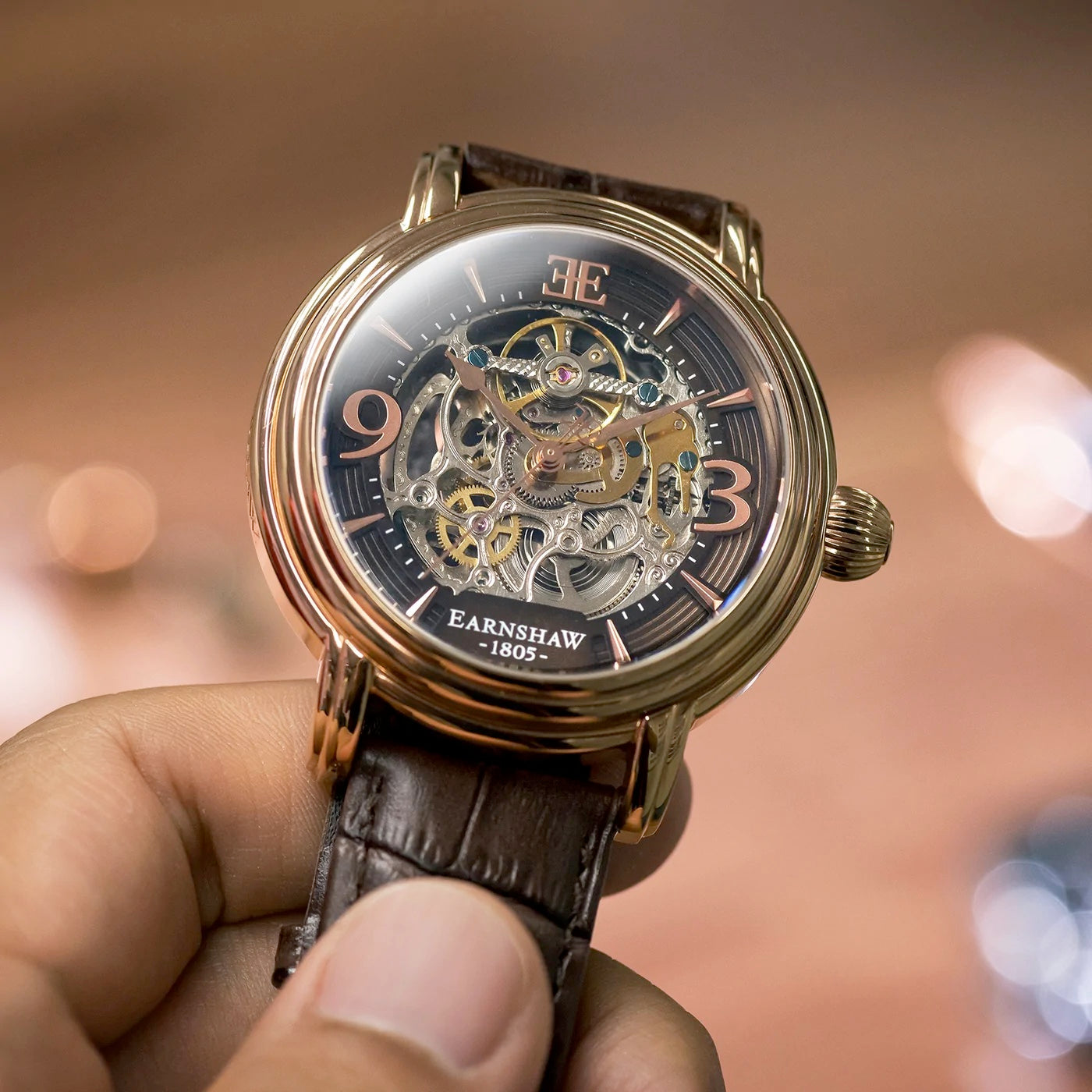 THOMAS EARNSHAW LONGCASE GRANDE SKELETON AUTOMATIC Brandy Rose Gold